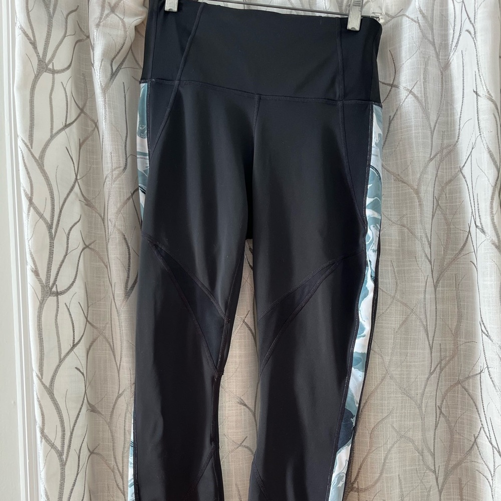 Athleta leggings, full length, high-rise waistband, and side pattern.